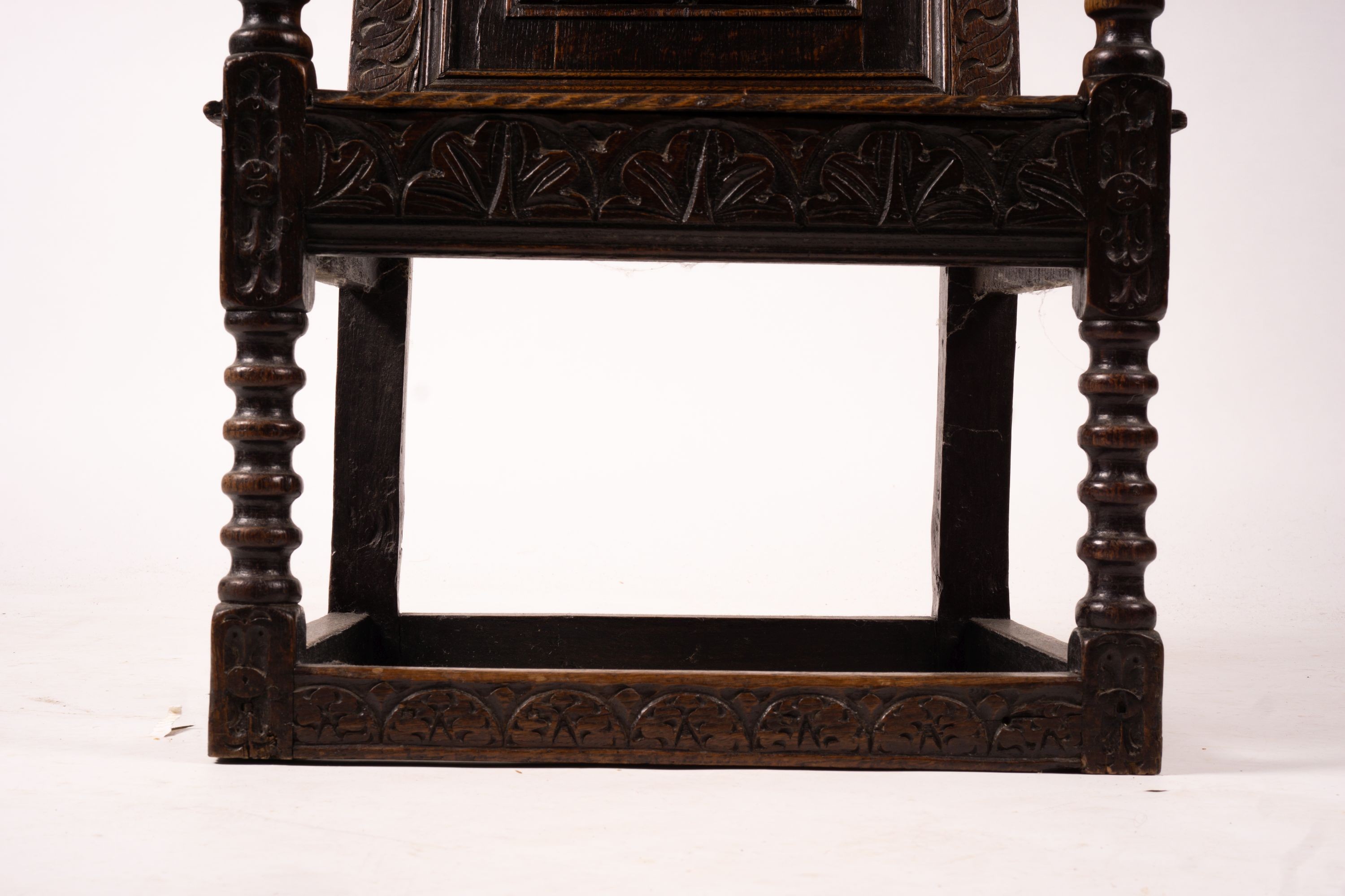 An 18th century style carved oak wainscot chair, width 56cm, depth 60cm, height 101cm